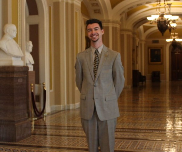 UTK congressional Intern standing in hallway smiling