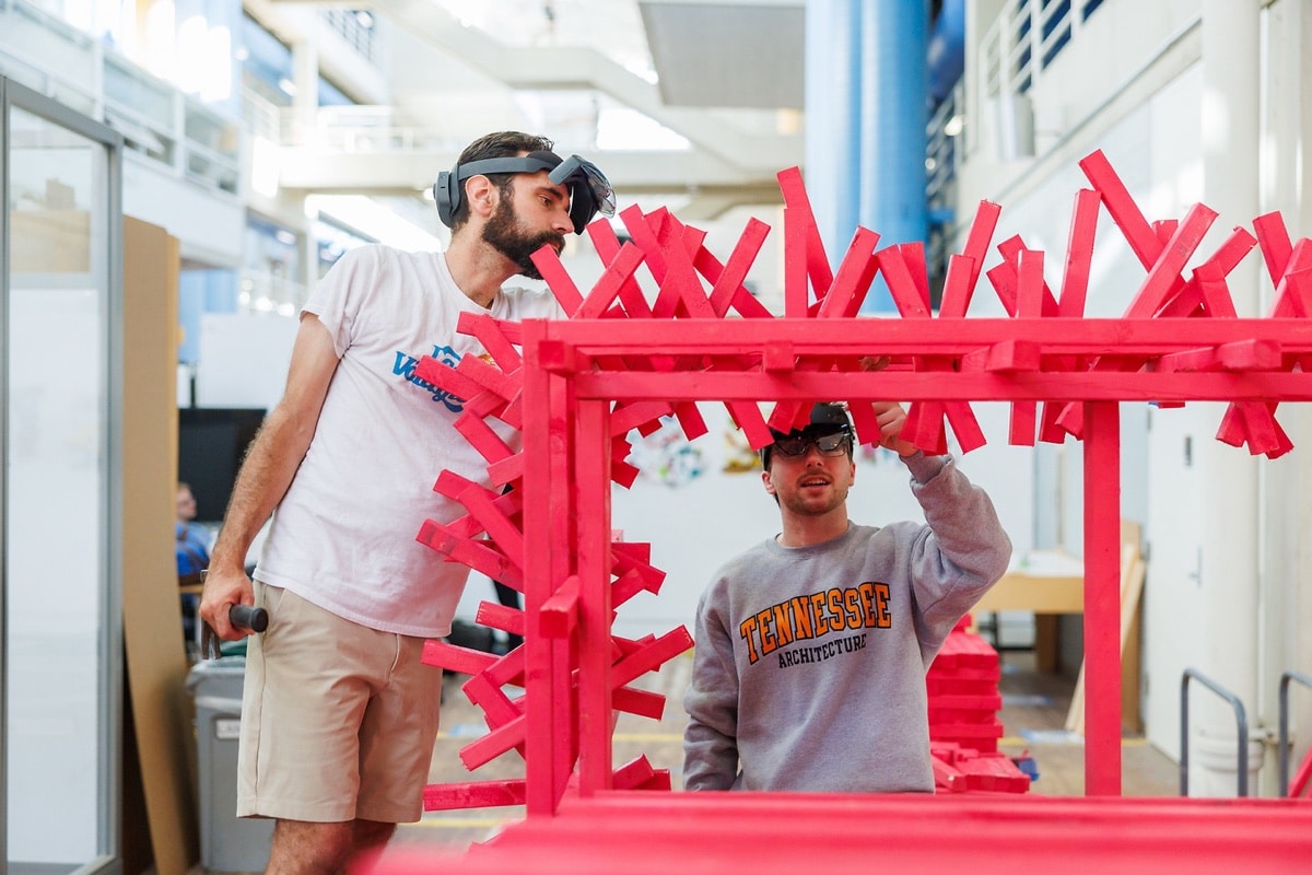 Students assemble a large modular structure in a hands-on design-build project