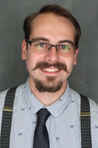 Professional headshot of Adam Lanagan