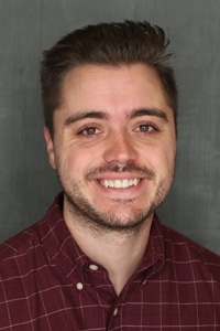 Professional headshot of Evan Jamison