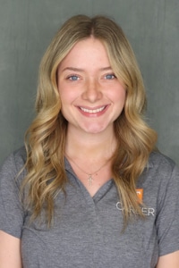 Professional headshot of Tessa Dostal