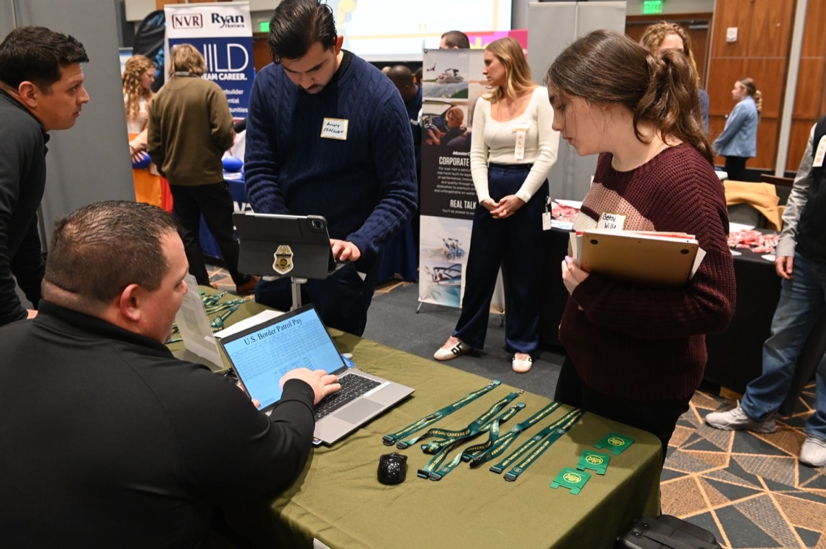 Students meet with employers at a UT career fair