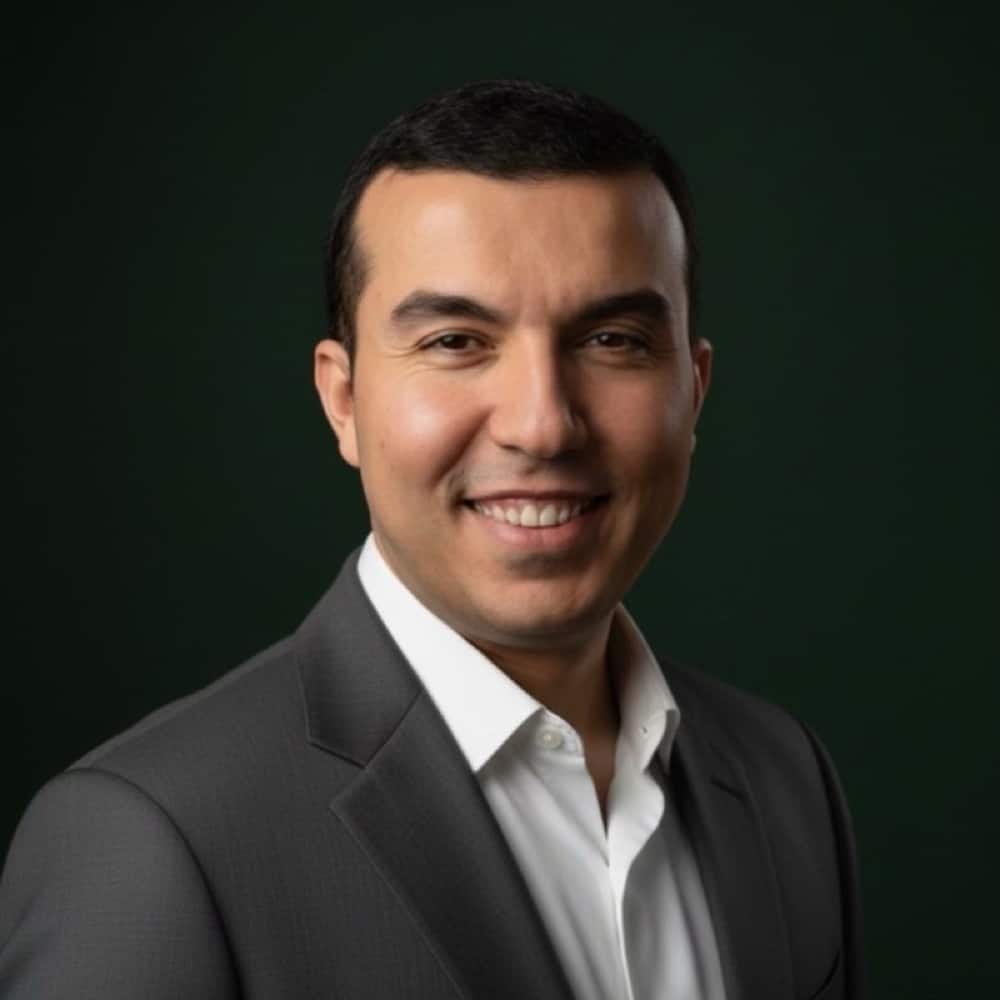 Professional headshot of Mustafa Oz