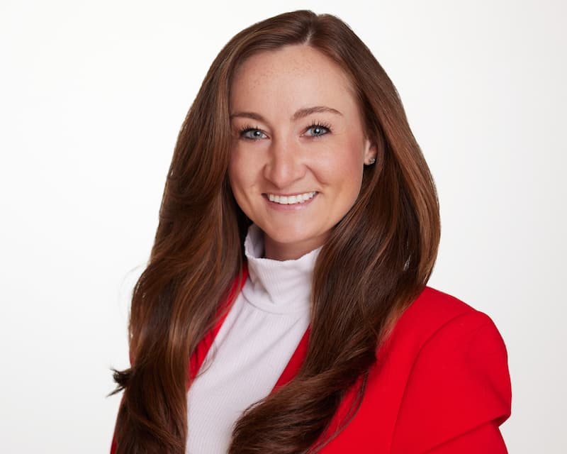 Professional headshot of Phoebe Bates